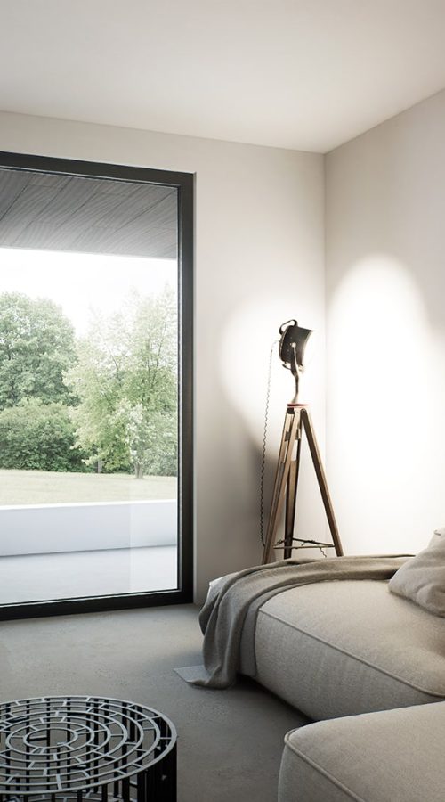 Porta finestra in alluminio con telaio sottile e design contemporaneo, che collega gli interni al giardino.